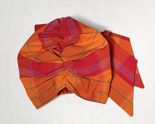 An orange and pink hair turban
